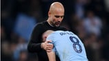 AGONY: Pep Guardiola consoles Ilkay Gundogan after the final whistle