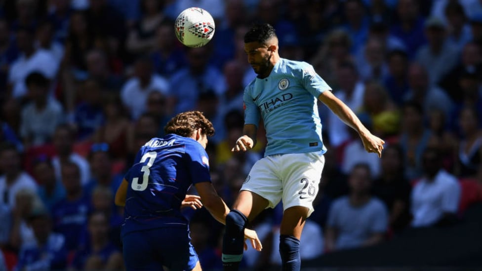 HEAD BOY : Riyad Mahrez gets an early taste of the action for City as he beats Marcos Alonso