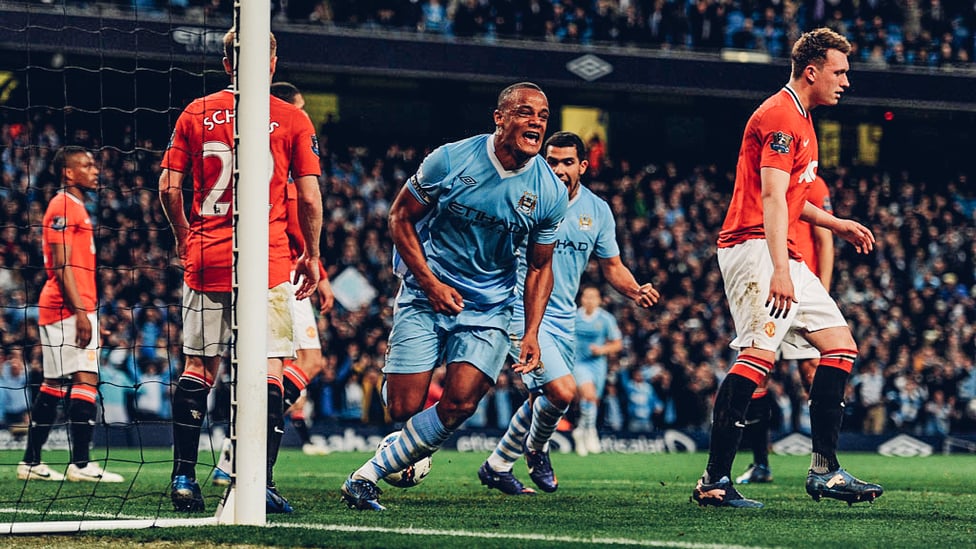 DERBY DELIGHT : Vincent Kompany's face says it all as he crashed home a winner that sent us top of the league on goal difference with two games of the 2011/12 season left to play.