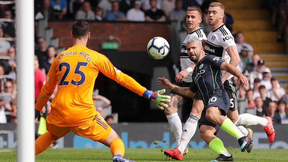 LIFT-OFF : Sergio Aguero places the ball over Rico to double City's lead