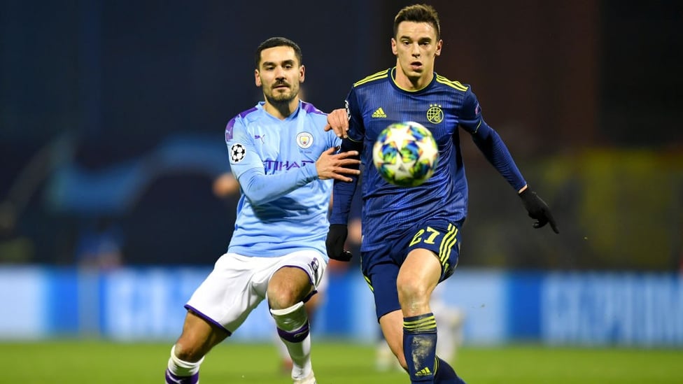 PATROLLING : Ilkay Gundogan competes with Nikola Moro in midfield.