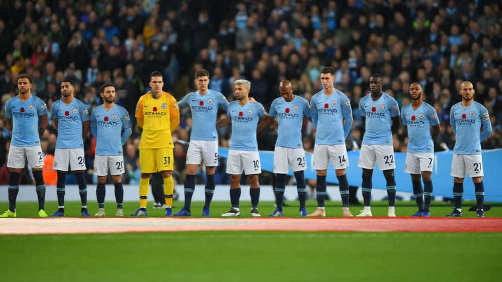 SOMBRE MOMENT : The players paused to commemorate the 100th anniversary of the Armistice