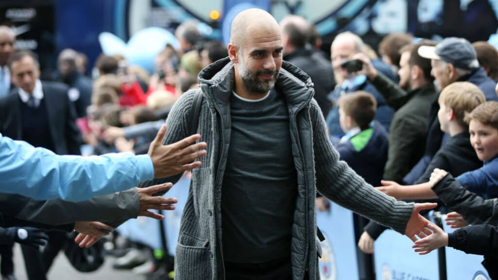 BOSS MAN : Pep arrives at the Etihad to a rapturous reception.