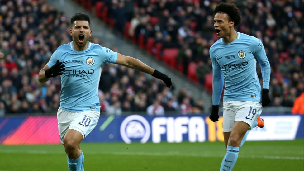 ROAR POWER : Sergio celebrates with Leroy Sane after netting in the 2018 Carabao Cup final against Arsenal
