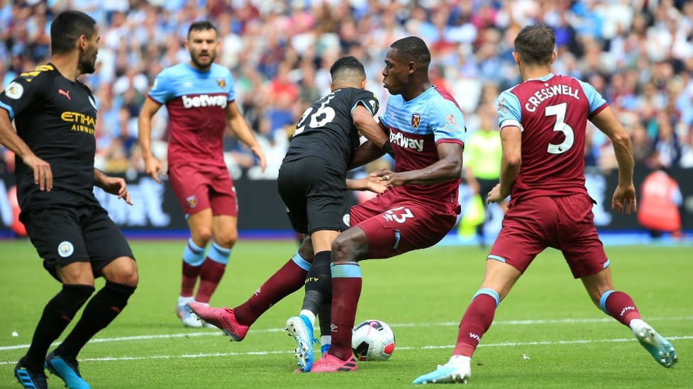 PENALTY : Riyad Mahrez is felled in the area.