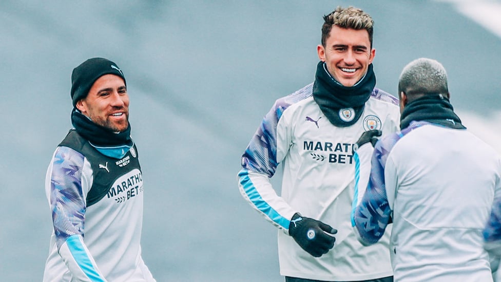 LAPPING IT UP : Aymeric Laporte shares a smile with Benjamin Mendy and Nicolas Otamendi