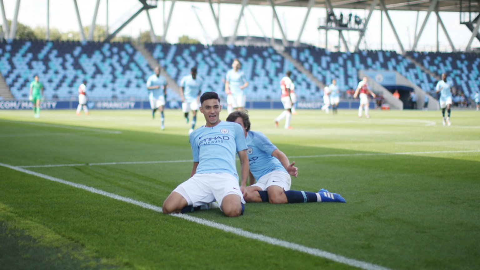 SHARP SHOOTER: Nabil Touaizi celebrates scoring against Arsenal