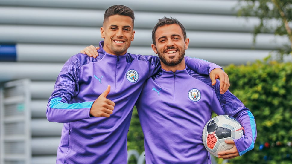 PLEASED TO BE BACK : Joao Cancelo and Bernardo Silva are all smiles ahead of training