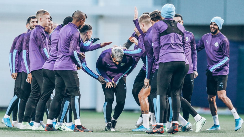 TUNNEL VISION : Sergio Aguero is mobbed by his teammates