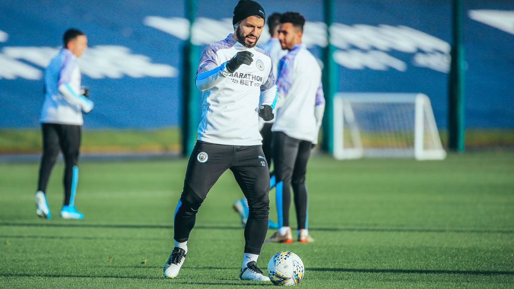 FUN IN THE SUN: Aguero gets straight back into the thick of things.