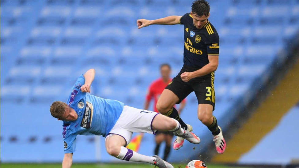 SLIDE RULE: Kevin De Bruyne challenges Kieran Tierney