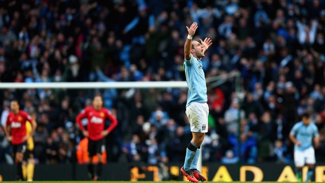Pablo Zabaleta celebrating with City fans in the Manchester Derby