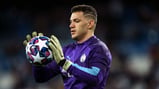 SAFE HANDS: Ederson warms the gloves before kick-off