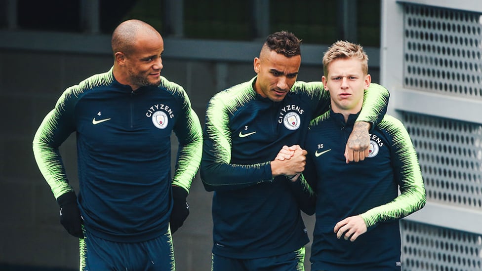 THREE CHEERS : Vincent Kompany, Danilo and Oleksandr Zinchenko get in the zone