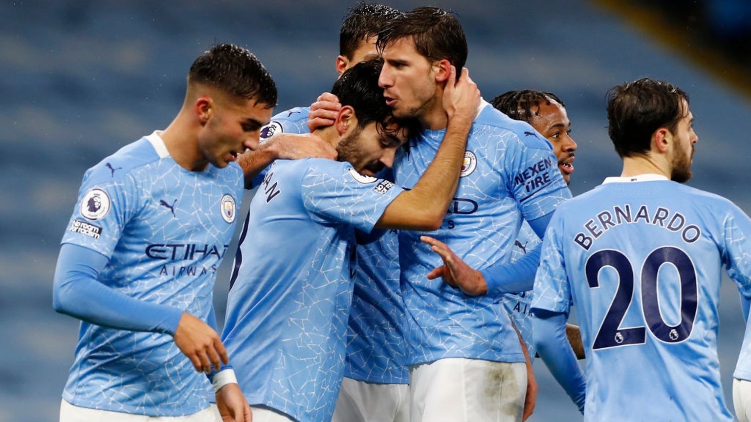 FESTIVE SPIRIT: The players share the love after Gundogan's composed finish.