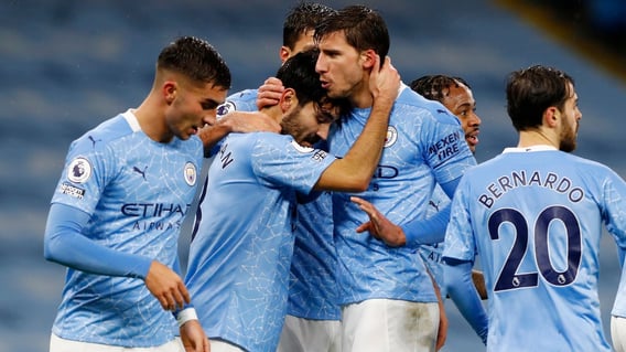 FESTIVE SPIRIT: The players share the love after Gundogan's composed finish.