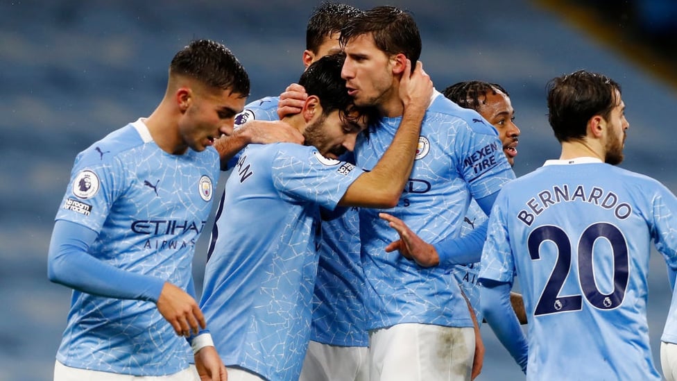 FESTIVE SPIRIT : The players share the love after Gundogan's composed finish.