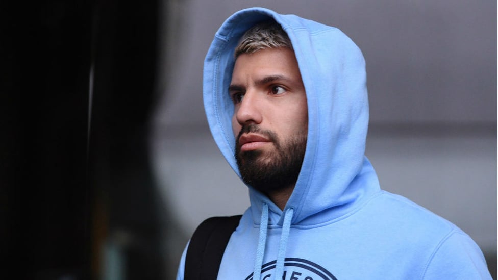 SERGE IN THE HOOD : Kun arrives at the Liberty Stadium kitted out to ward off the South Wales downpour