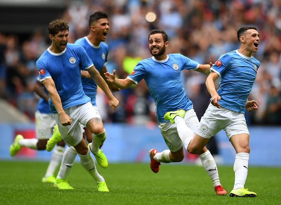 Great start : Celebrations as we beat Liverpool o penalties in the Community Shield