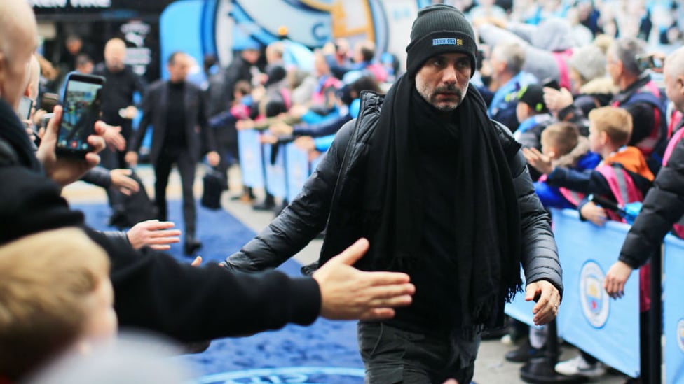 GAME FACE : The boss fully focused as he's greeted by fans.