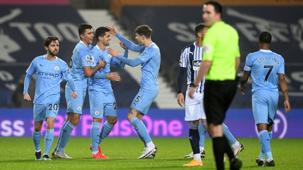 ALL SMILES : Cancelo beams as the team celebrate his sumptuous goal.