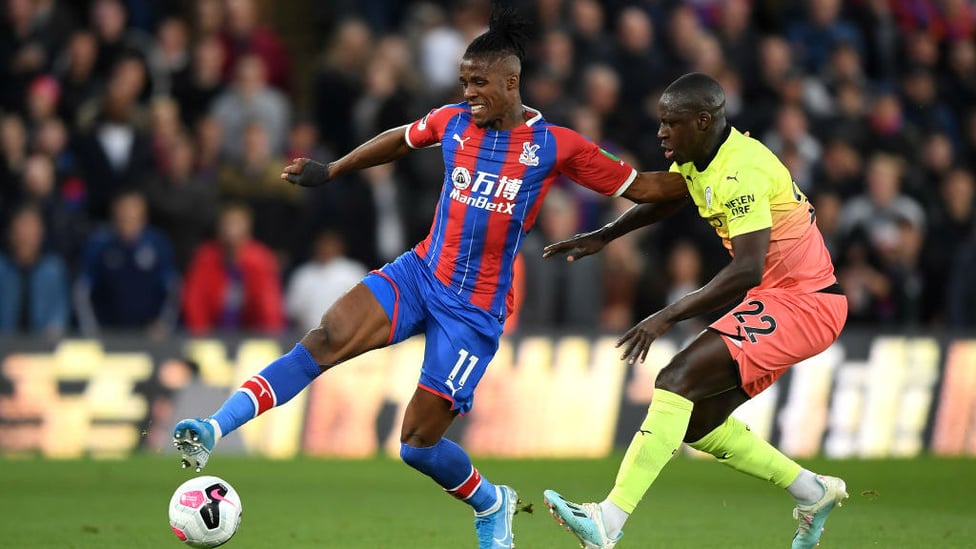 BATTLE : Mendy pressurises Palace danger-man Zaha in an intriguing battle between the pair.