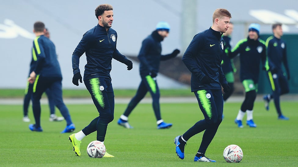 TWO'S COMPANY : Kyle Walker and Kevin De Bruyne limber up for action