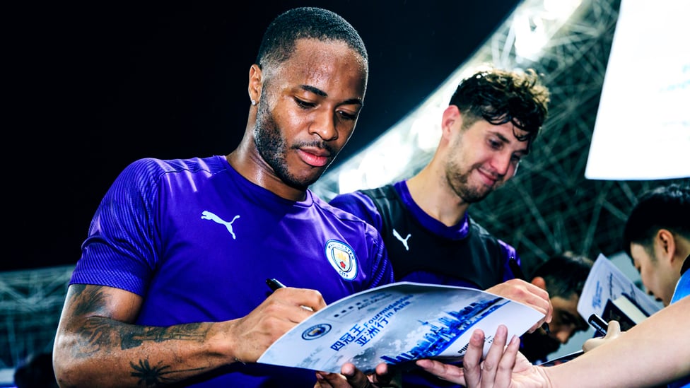 PEN PALS : Raheem Sterling and John Stones sign on the dotted line!