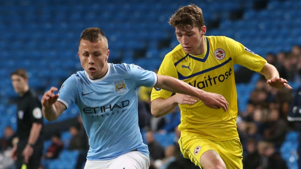 ACTION STATIONS : Angelino locks horns during our Under 21 Premier League Cup final with Reading