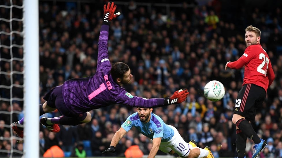 CLOSE : De Gea spectacularly palms away Aguero's accurate header.