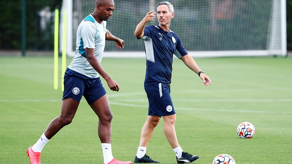 NEXT DRILL: Fernandinho limbers up as Carlos Vicens passes on some instructions