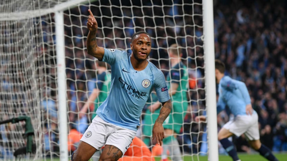 THREE CHEERS : Raheem Sterling wheels away in triumph after netting his second and City's third goal