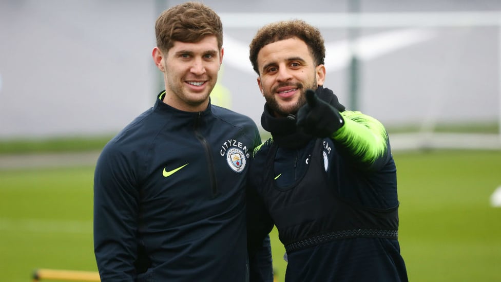 RUMBLED : Kyle Walker and John Stones notice the camera