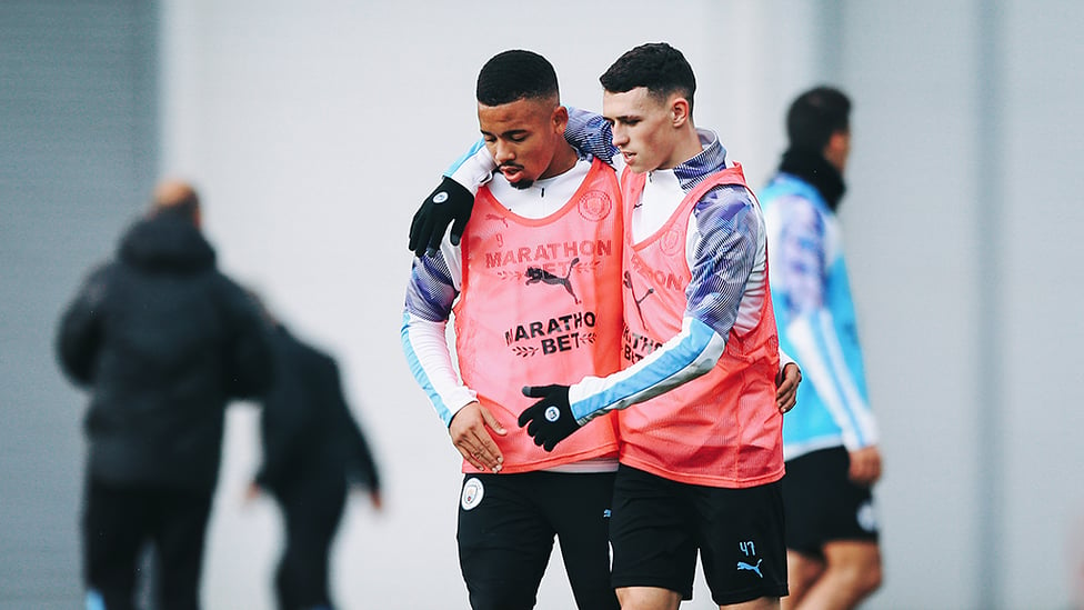 PHILLING IN THE GABS : An arm round the shoulder for Phil Foden and Gabriel Jesus