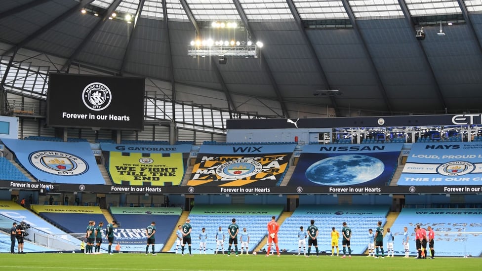 RESPECT : All players, officials and staff observe a minute of remembrance before the match gets underway.