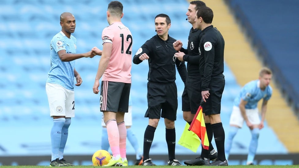 GAME TIME : Fernandinho and Egan share a fist bump as kick-off approaches.