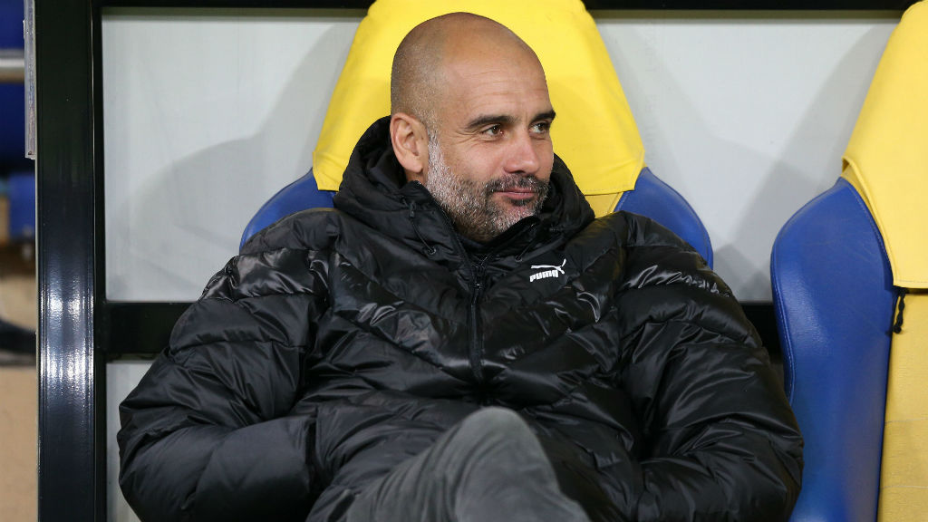 
                        LEADING MAN : Pep Guardiola takes in the atmosphere at the Metalist Stadium ahead of kick-off
                