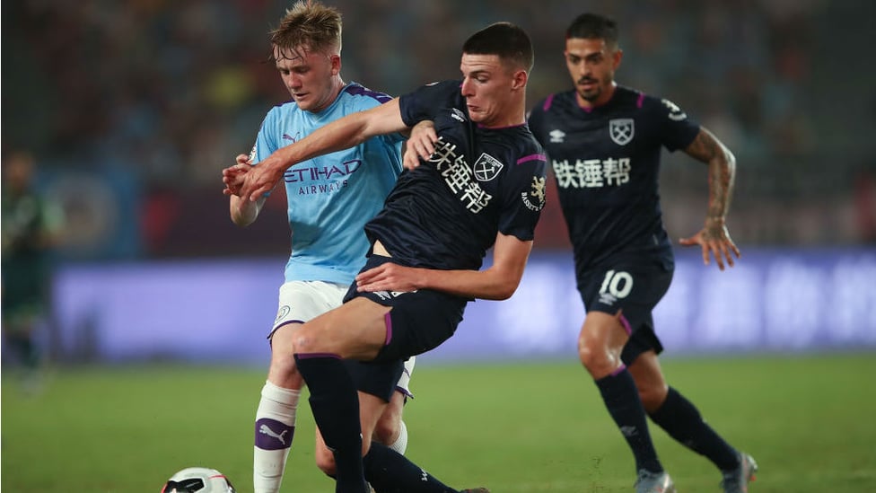 YOUNG GUN : Tommy Doyle, on his first senior start for City, challenges Declan Rice