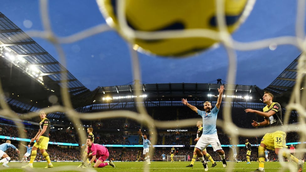 CONTRASTING EMOTIONS : Aguero leaps in delight at the winner as Southampton's players look on in despair.