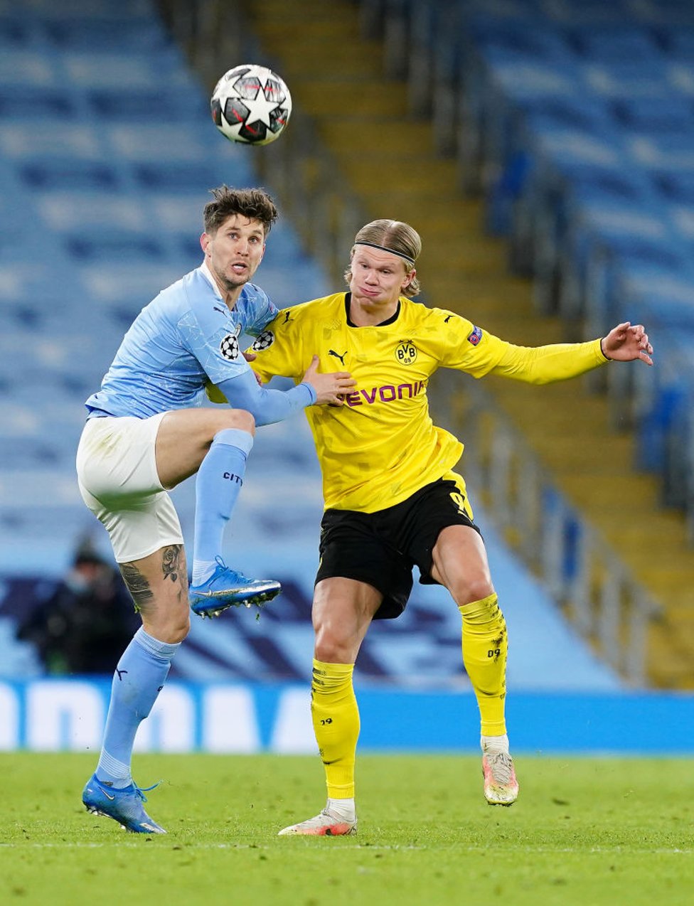 TOUCH TIGHT : Stones and Haaland jostle for possession.