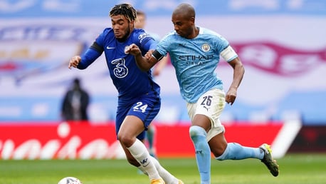 MY BALL: Fernandinho and Reece James battle for possession 