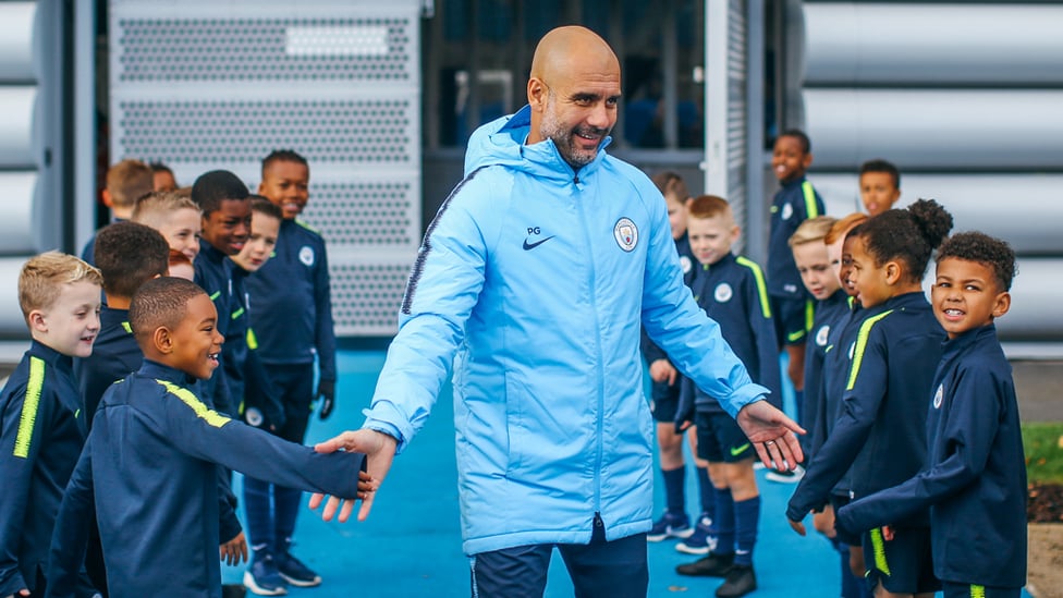 BOSS : Pep Guardiola greets our Under-8s.