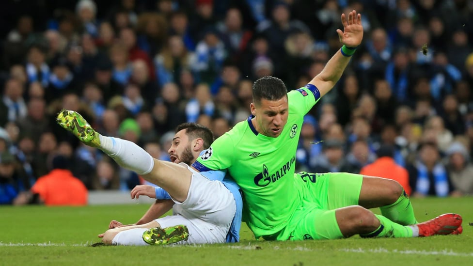 TUSSLE : Bernardo Silva is brought down in the area, earning City a penalty