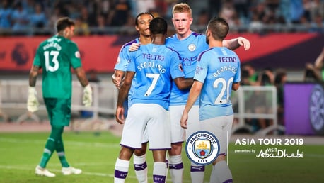 CELEBRATION: Kevin De Bruyne congratulates Raheem Sterling in Nanjing.