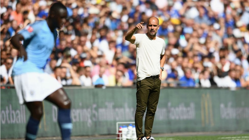 PEP TALK : City boss Pep Guardiola passes on instructions to Benjamin Mendy