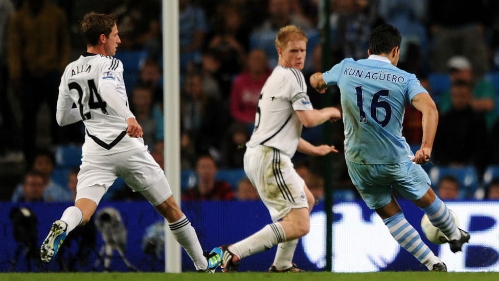 SUDDEN IMPACT : Sergio scores his first goal for City on his debut after coming on as a substitute against Swansea in August 2011