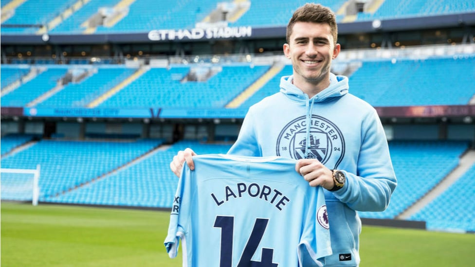 TRUE BLUE : Aymeric Laporte proudly displays his City shirt after completing his move to the Club