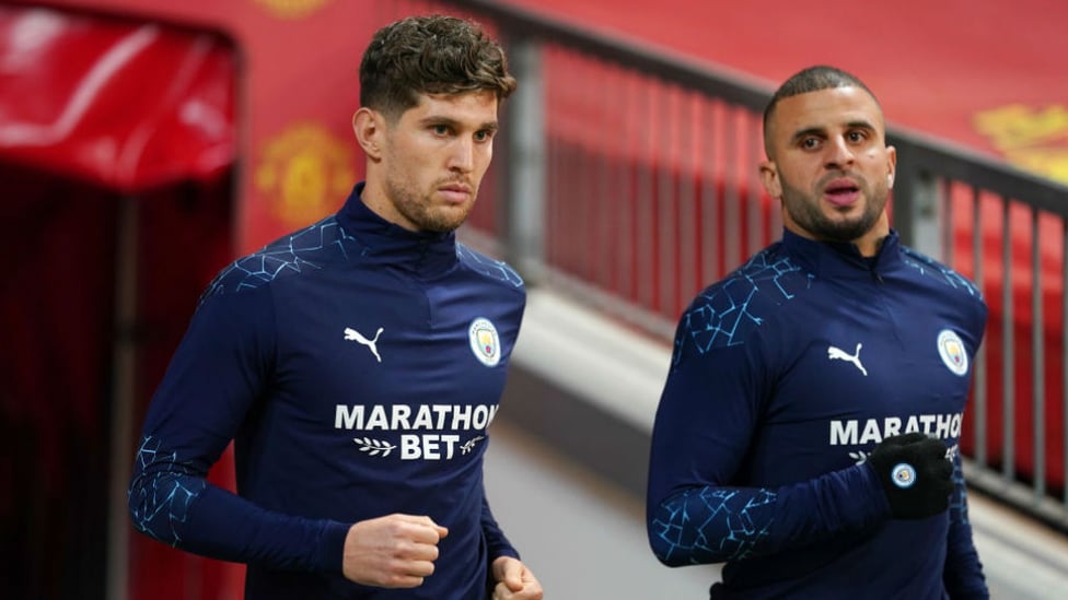 GAMES FACES ON: John Stones and Kyle Walker are a study in focus pre kick-off