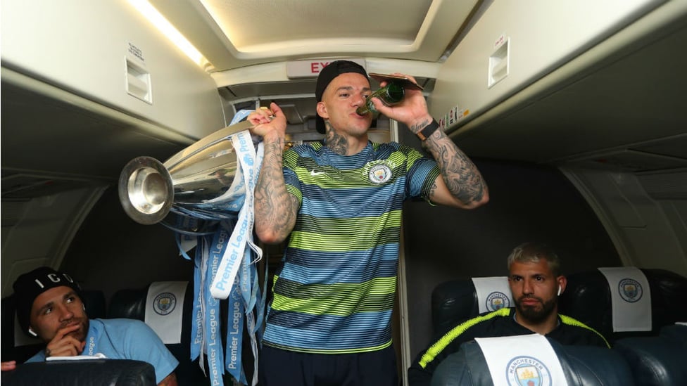 DRINKING IT ALL IN : Ederson savours the moment with a drink - and the Premier League title!