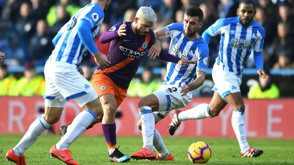 PERSISTENCE : Sergio muscles his way through the Terriers' defence